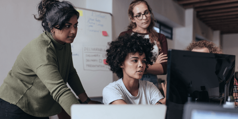 Computer programmers solving a problem as a team