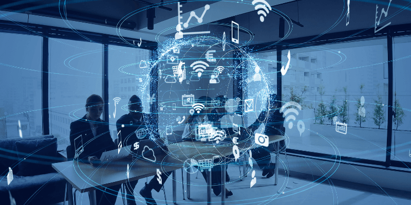 An office with a blue overlay, and a graphic of a globe with several application icons circling it.